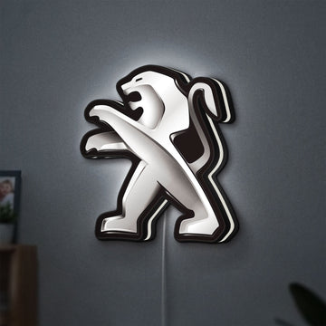 Peugeot LED lightbox hanging on a wall with white glow
