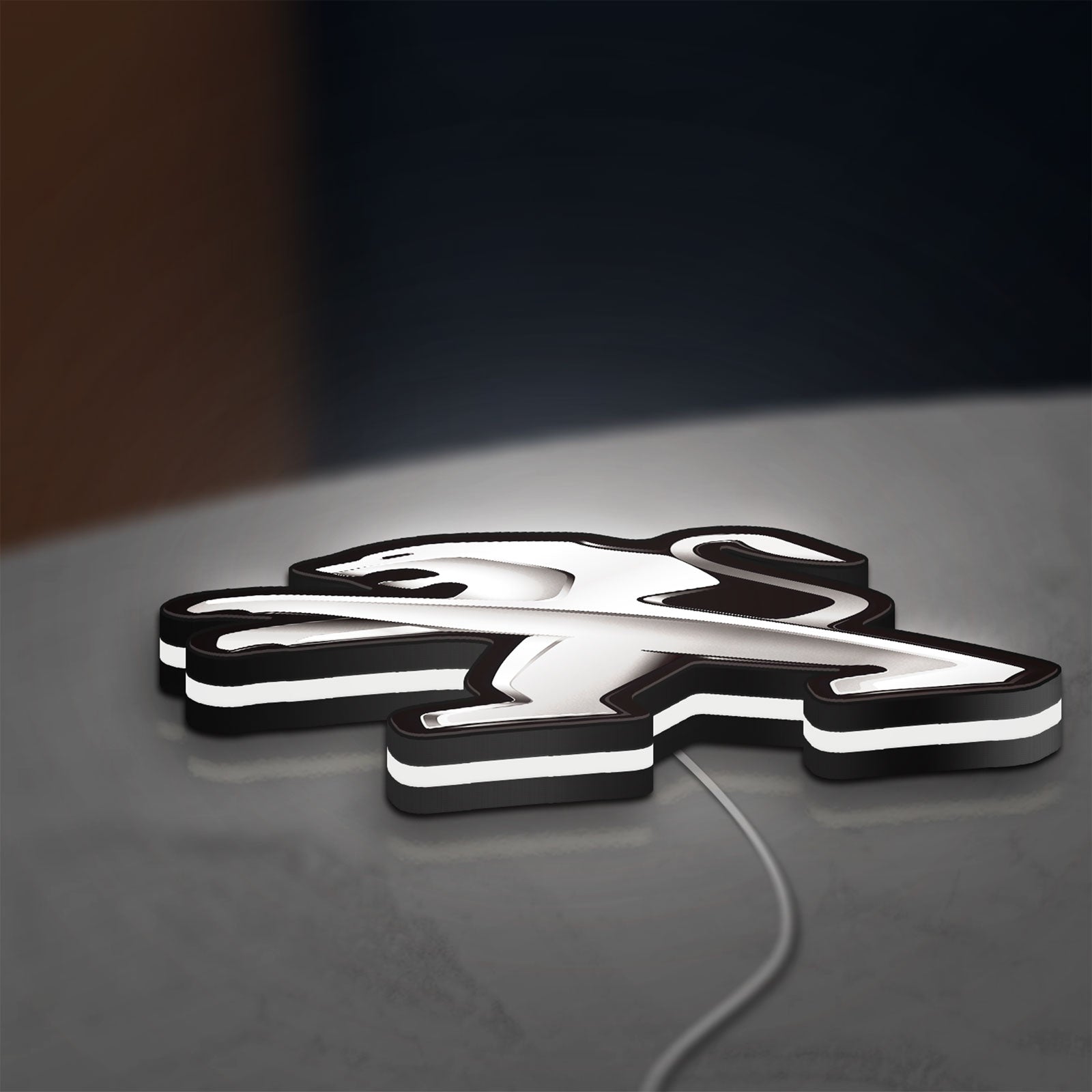 Peugeot LED lightbox lying flat on a desk with white glow