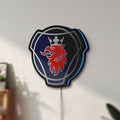 Unlit Scania Griffin LED lightbox mounted on a wall in daylight