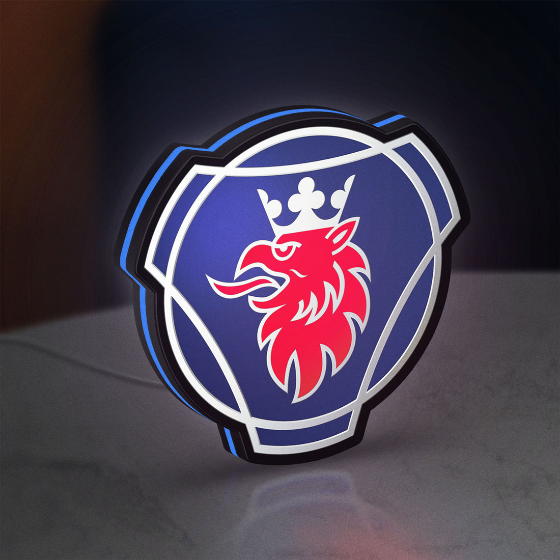 Scania Griffin LED lightbox hanging on a wall with blue glow
