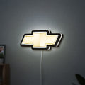 Chevrolet LED lightbox hanging on a wall with white glow