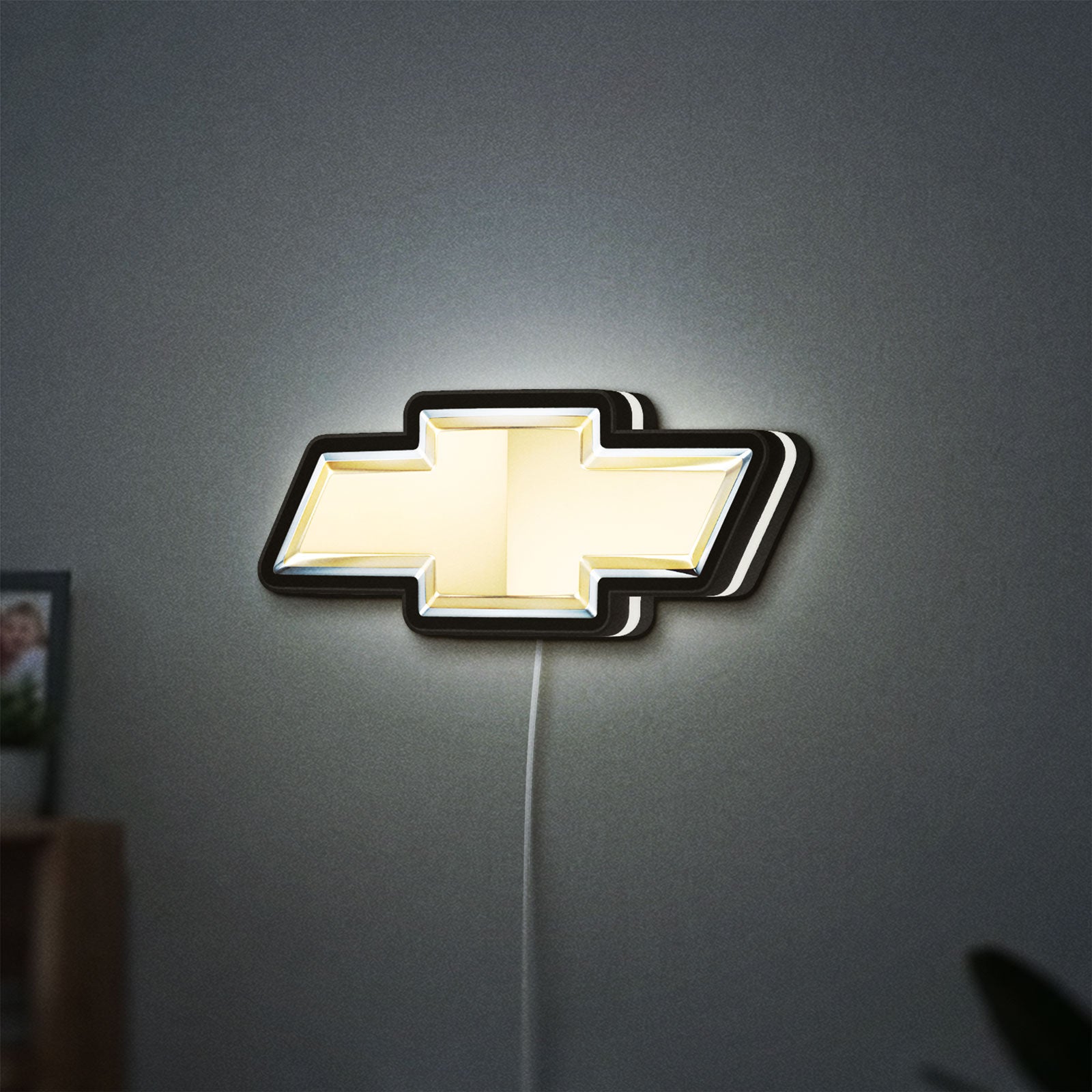 Chevrolet LED lightbox hanging on a wall with white glow