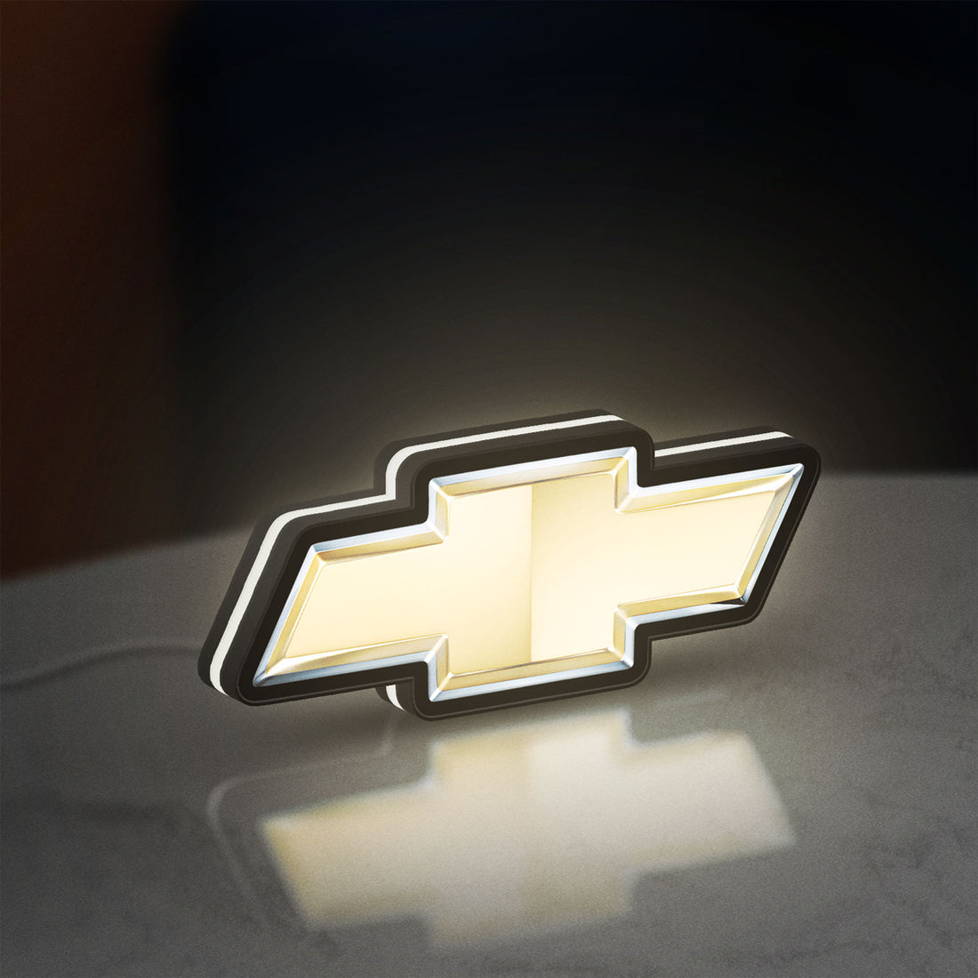 Chevrolet LED lightbox hanging on a wall with white glow