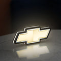 Chevrolet LED lightbox standing on a desk from an angled side view with white glow