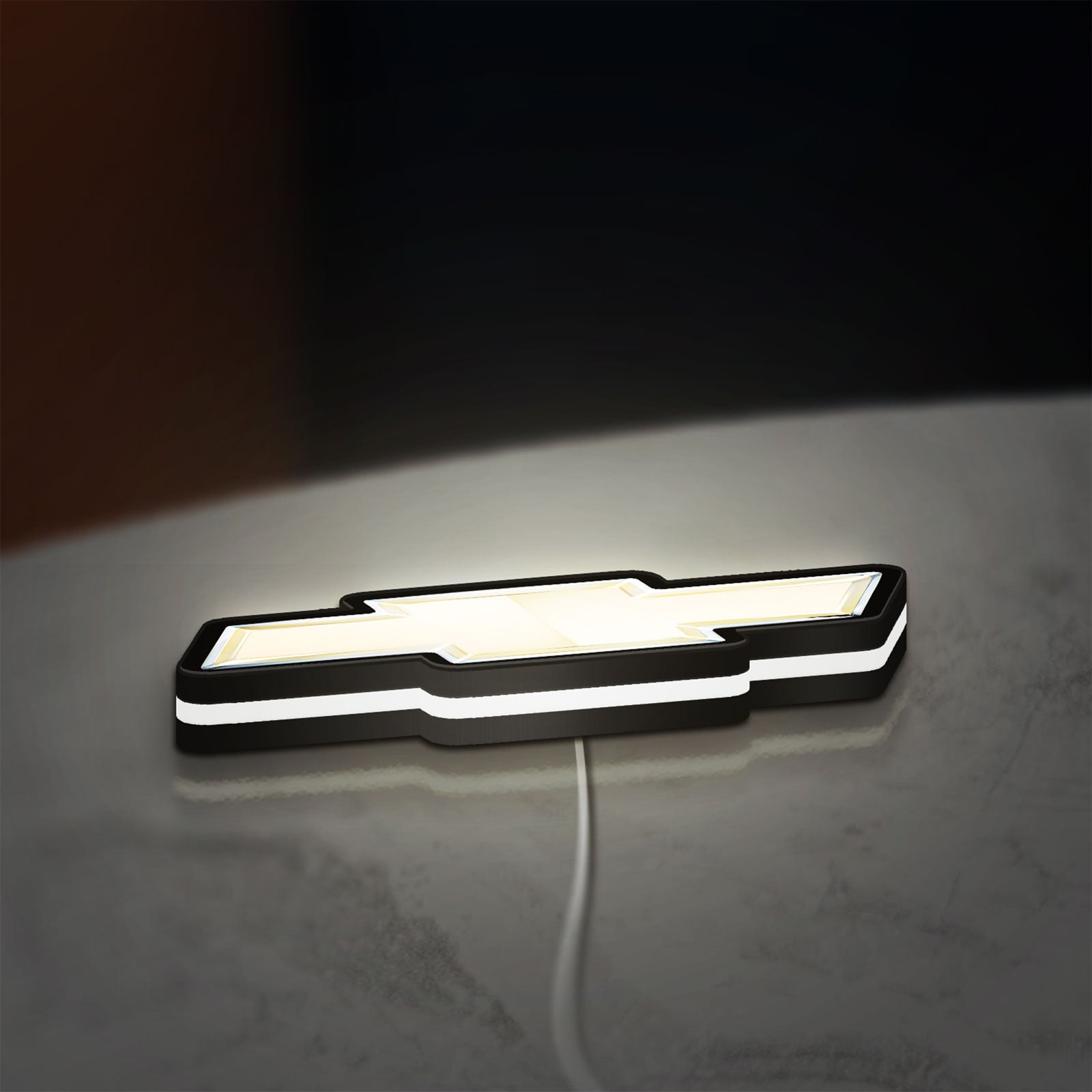 Chevrolet LED lightbox lying flat on a desk with white glow