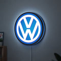 Volkswagen LED lightbox hanging on a wall with blue glow
