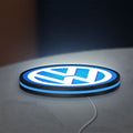Volkswagen LED lightbox lying flat on a desk with blue glow