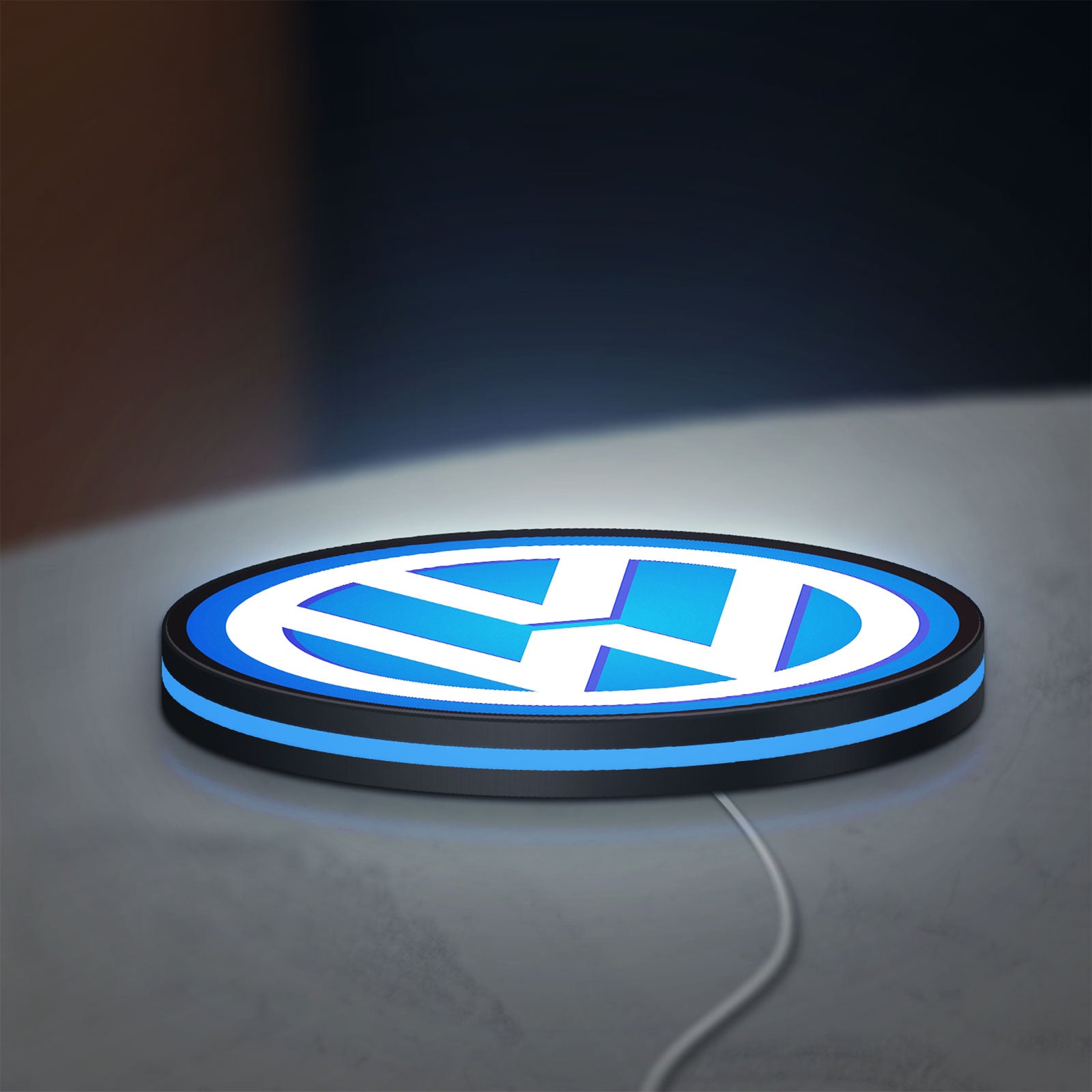 Volkswagen LED lightbox lying flat on a desk with blue glow