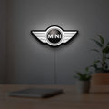 Mini Cooper LED lightbox hanging on a room wall with soft white light