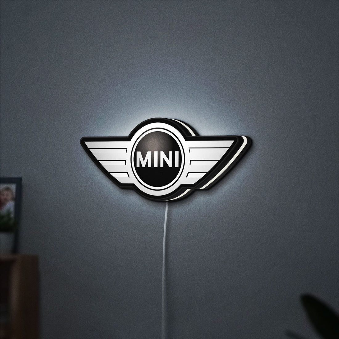 Mini Cooper LED lightbox hanging on a wall with white glow