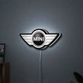 Mini Cooper LED lightbox hanging on a wall with white glow