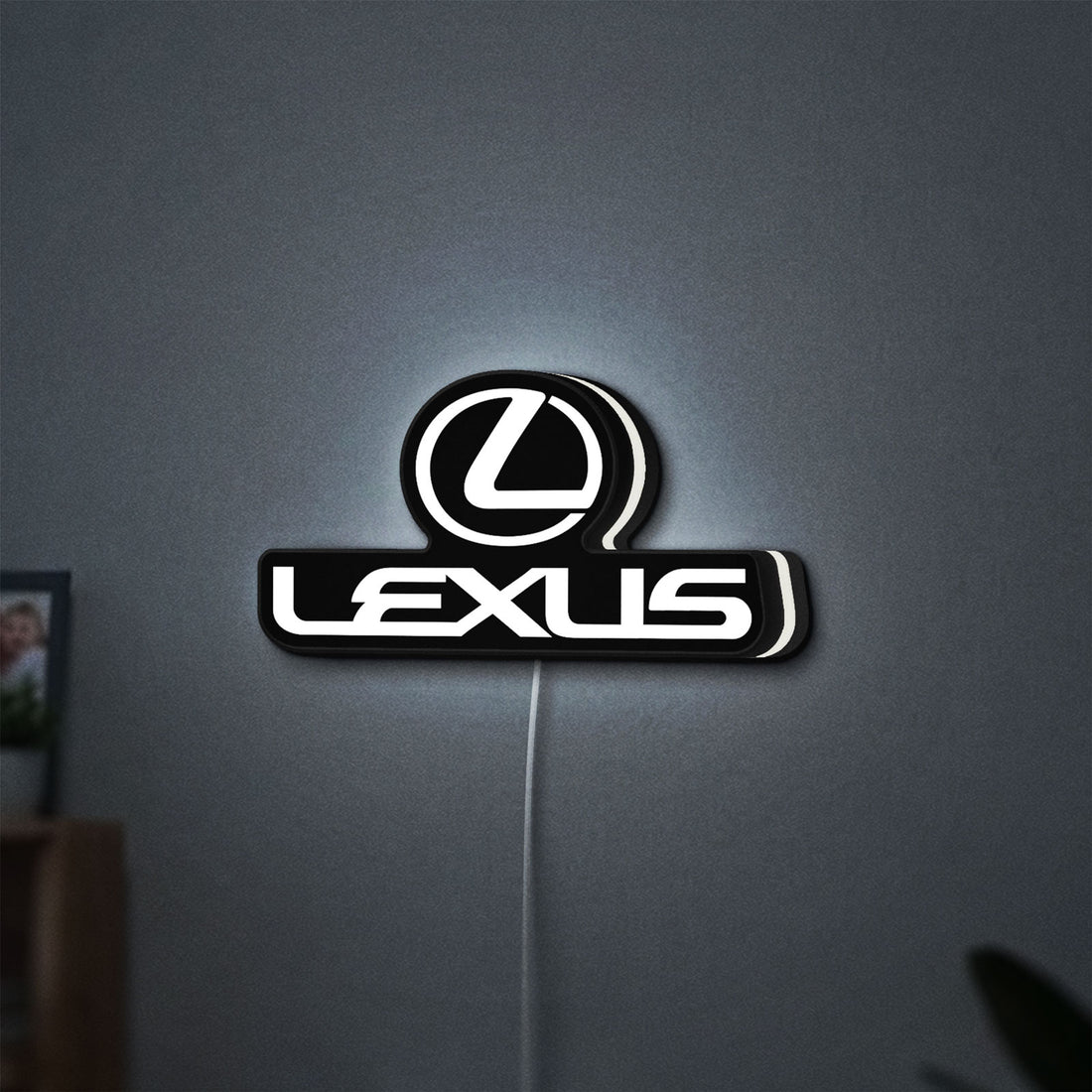 Lexus LED lightbox hanging on a wall with white glow