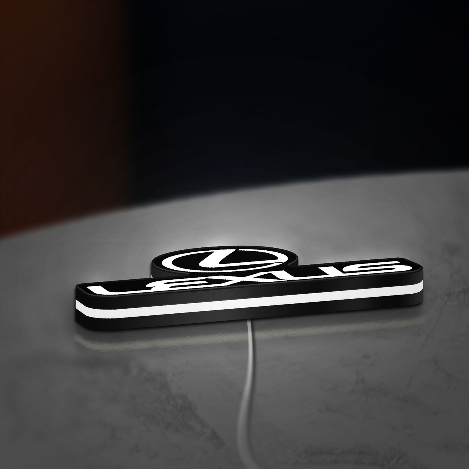 Lexus LED lightbox lying flat on a desk with white glow