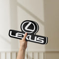 Unlit Lexus LED lightbox held by hand to show size and details