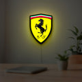 Ferrari GES LED lightbox hanging on a room wall with soft yellow light