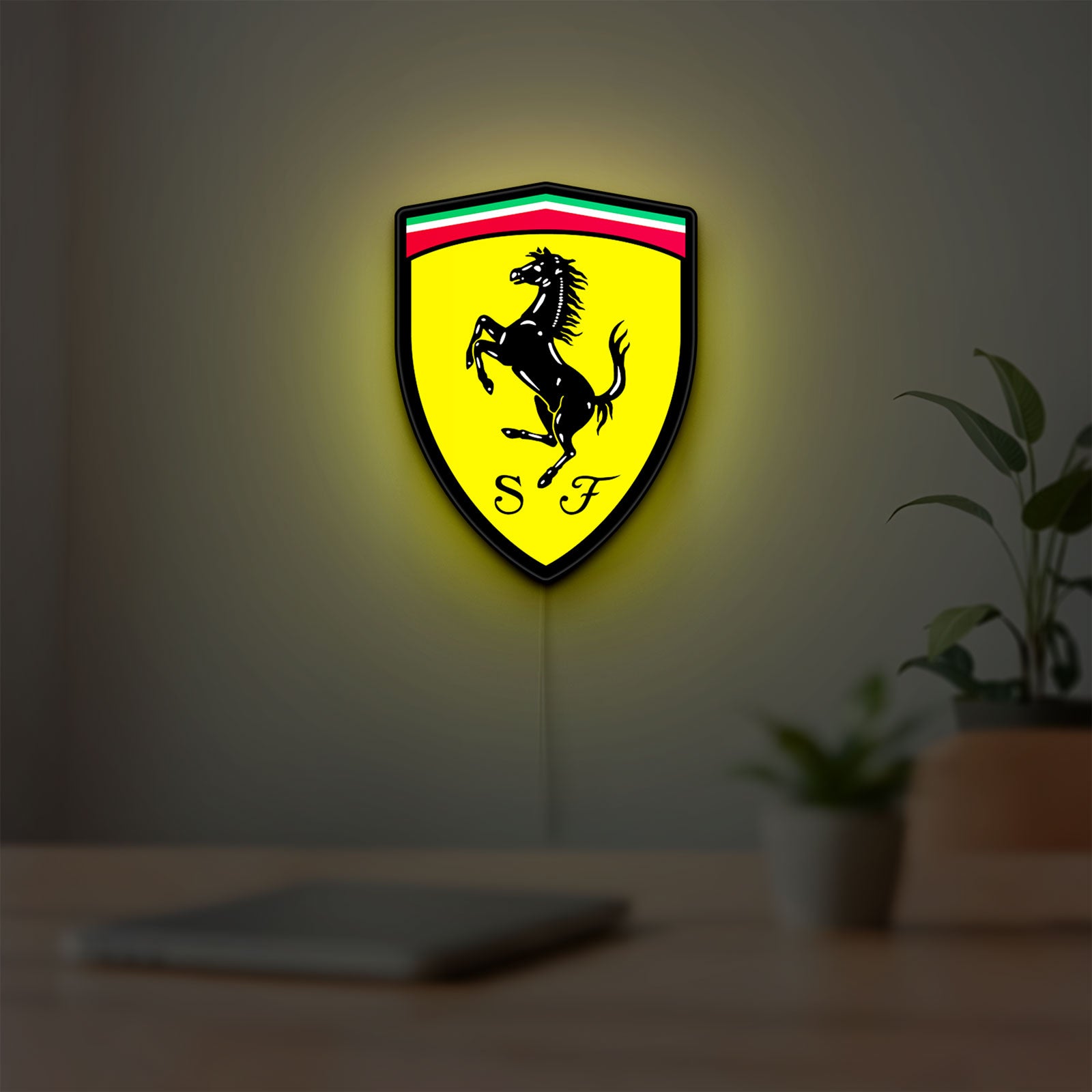 Ferrari GES LED lightbox hanging on a room wall with soft yellow light