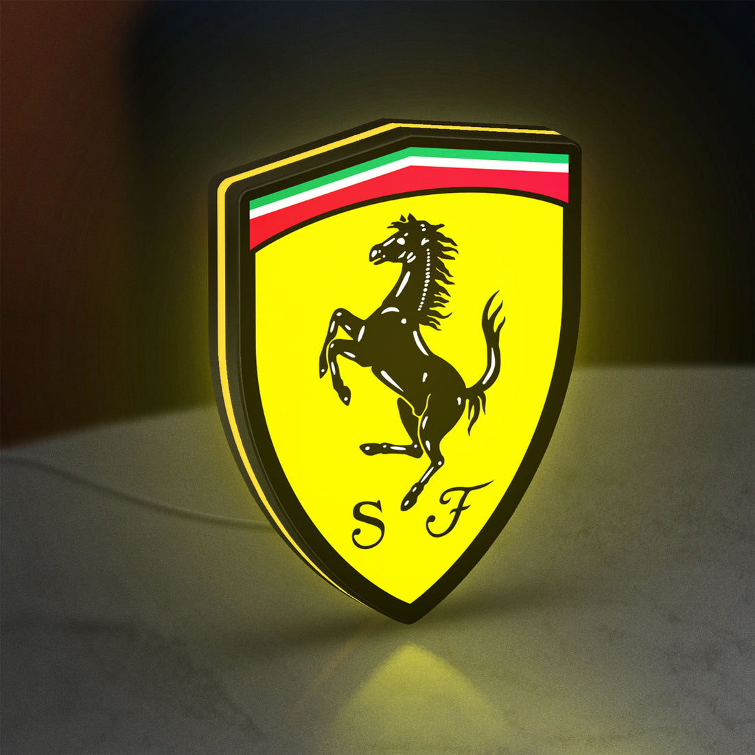 Ferrari GES LED lightbox hanging on a wall with yellow glow