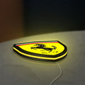 Ferrari GES LED lightbox lying flat on a desk with yellow glow