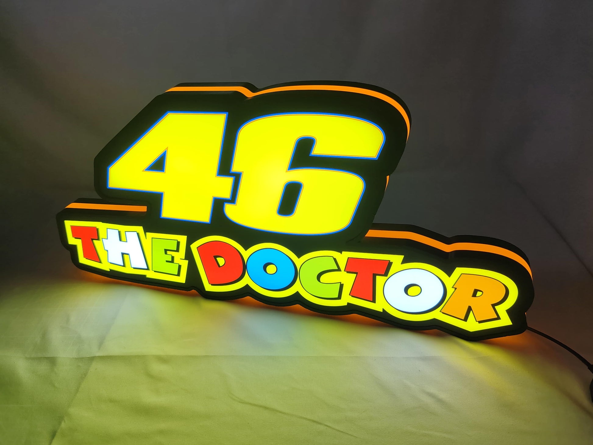 The doctor led light box 02 lit standing side view of 26Xbau0042 3D LED Sign in 60cm, unique wall art for desk and room decor