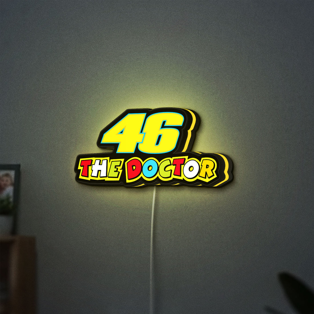 46 The Doctor LED lightbox hanging on a wall with yellow glow