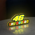 46 The Doctor LED lightbox standing on a desk from an angled side view with yellow glow
