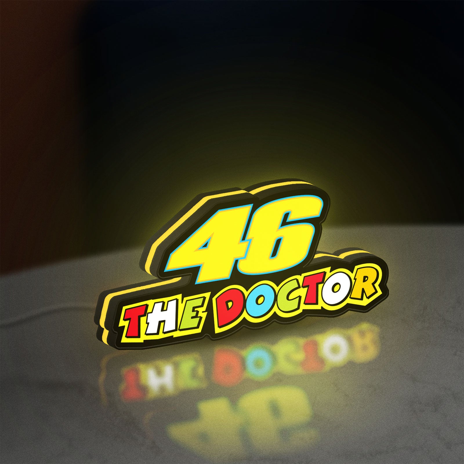 46 The Doctor LED lightbox standing on a desk from an angled side view with yellow glow