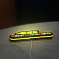 46 The Doctor LED lightbox lying flat on a desk with yellow glow