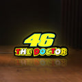 Front view of 46 The Doctor LED lightbox sign glowing on a wooden desk