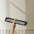 Unlit Bridgestone LED lightbox held by hand to show size and details