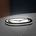 Mazda LED lightbox lying flat on a desk with white glow