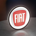 FIAT 2007 OLD LED lightbox standing on a desk from an angled side view with white glow