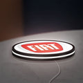 FIAT 2007 OLD LED lightbox lying flat on a desk with white glow