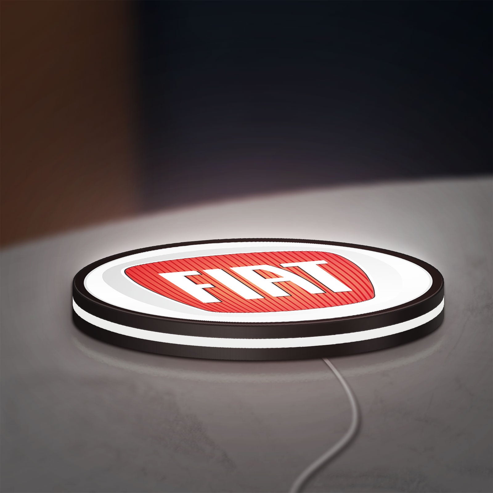 FIAT 2007 OLD LED lightbox lying flat on a desk with white glow