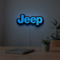 Jeep LED lightbox hanging on a room wall with soft blue light