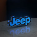 Jeep LED lightbox standing on a desk from an angled side view with blue glow