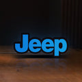 Front view of Jeep LED lightbox sign glowing on a wooden desk