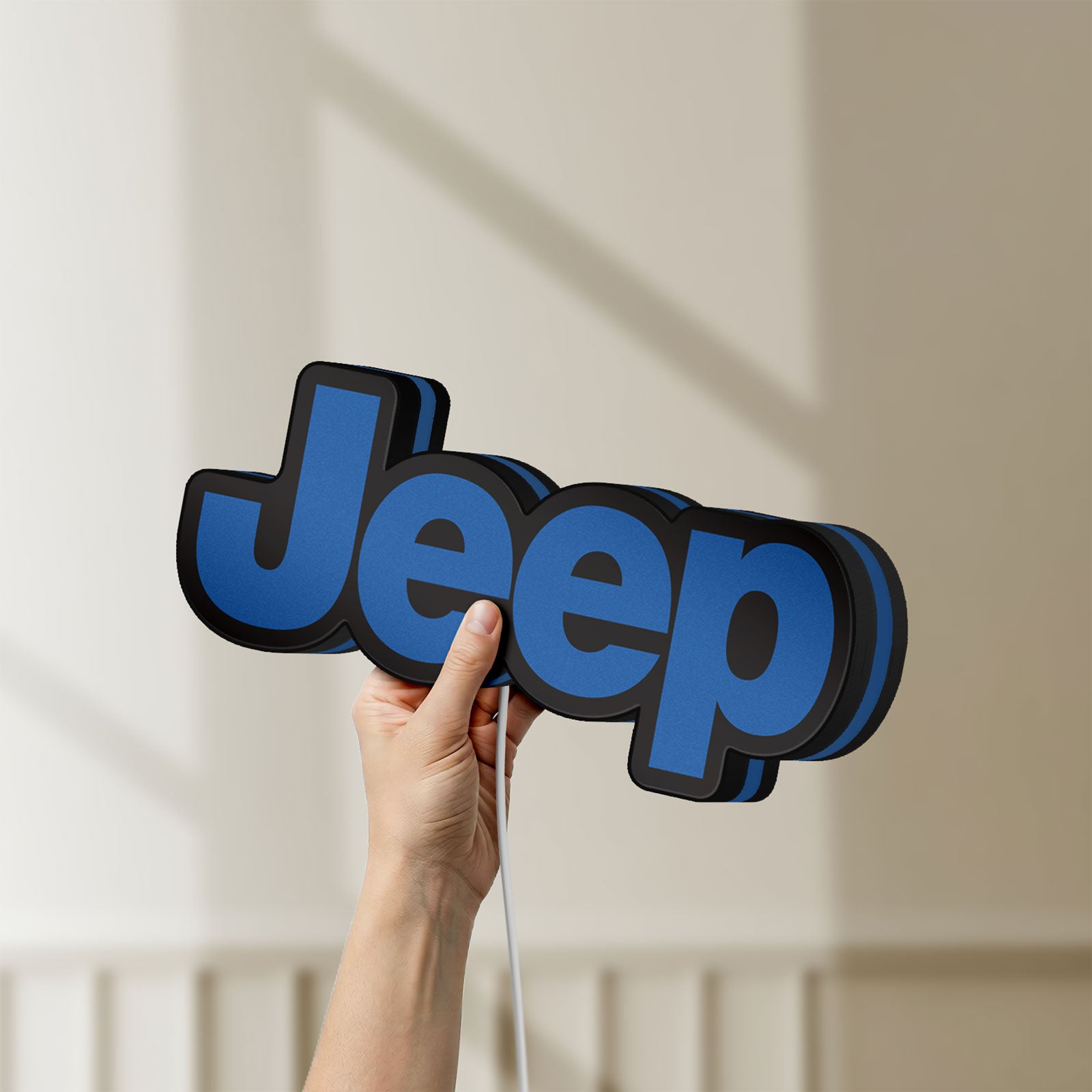 Unlit Jeep LED lightbox held by hand to show size and details