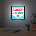 Bosch Service LED lightbox hanging on a room wall with soft white light