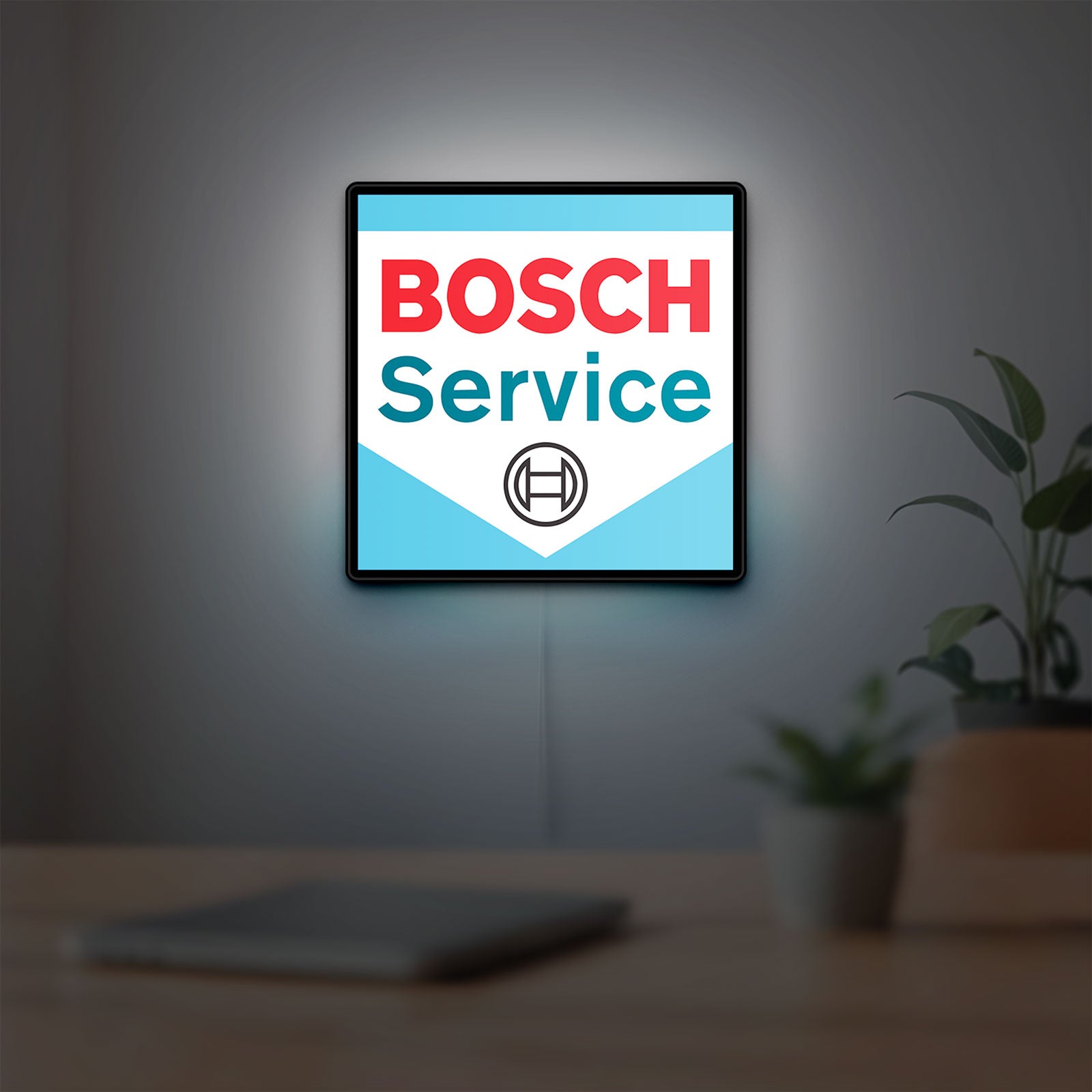 Bosch Service LED lightbox hanging on a room wall with soft white light