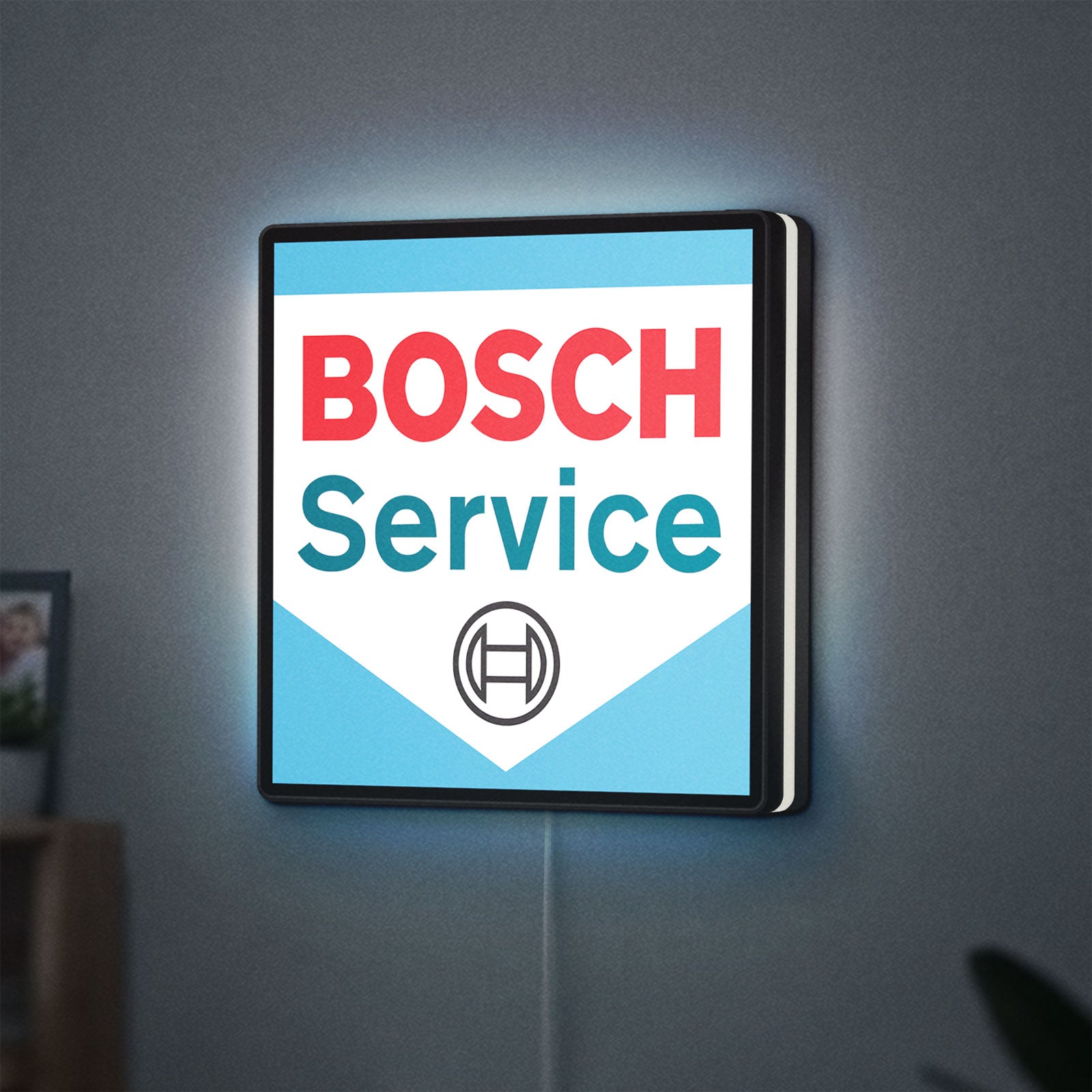 Bosch Service LED lightbox hanging on a wall with white glow