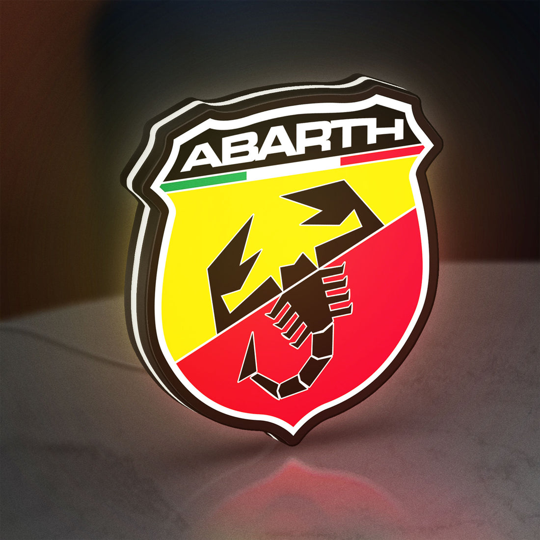 Abarth LED lightbox hanging on a wall with white glow