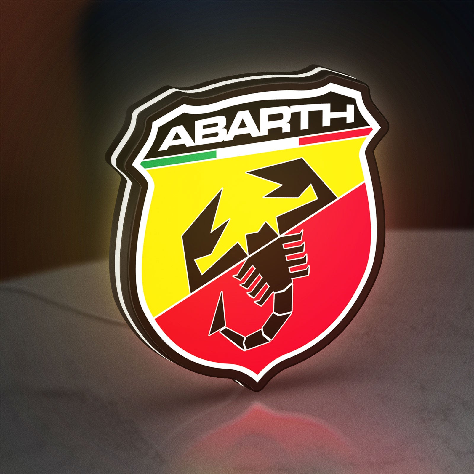 Abarth LED lightbox standing on a desk from an angled side view with white glow