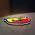 Abarth LED lightbox lying flat on a desk with white glow