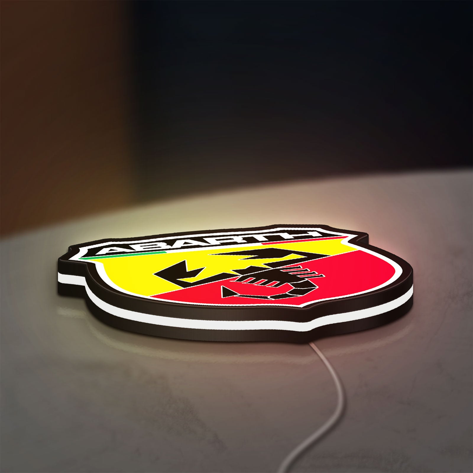 Abarth LED lightbox lying flat on a desk with white glow