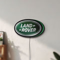 Unlit Land Rover LED lightbox mounted on a wall in daylight