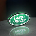 Land Rover LED lightbox standing on a desk from an angled side view with green glow
