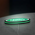 Land Rover LED lightbox lying flat on a desk with green glow