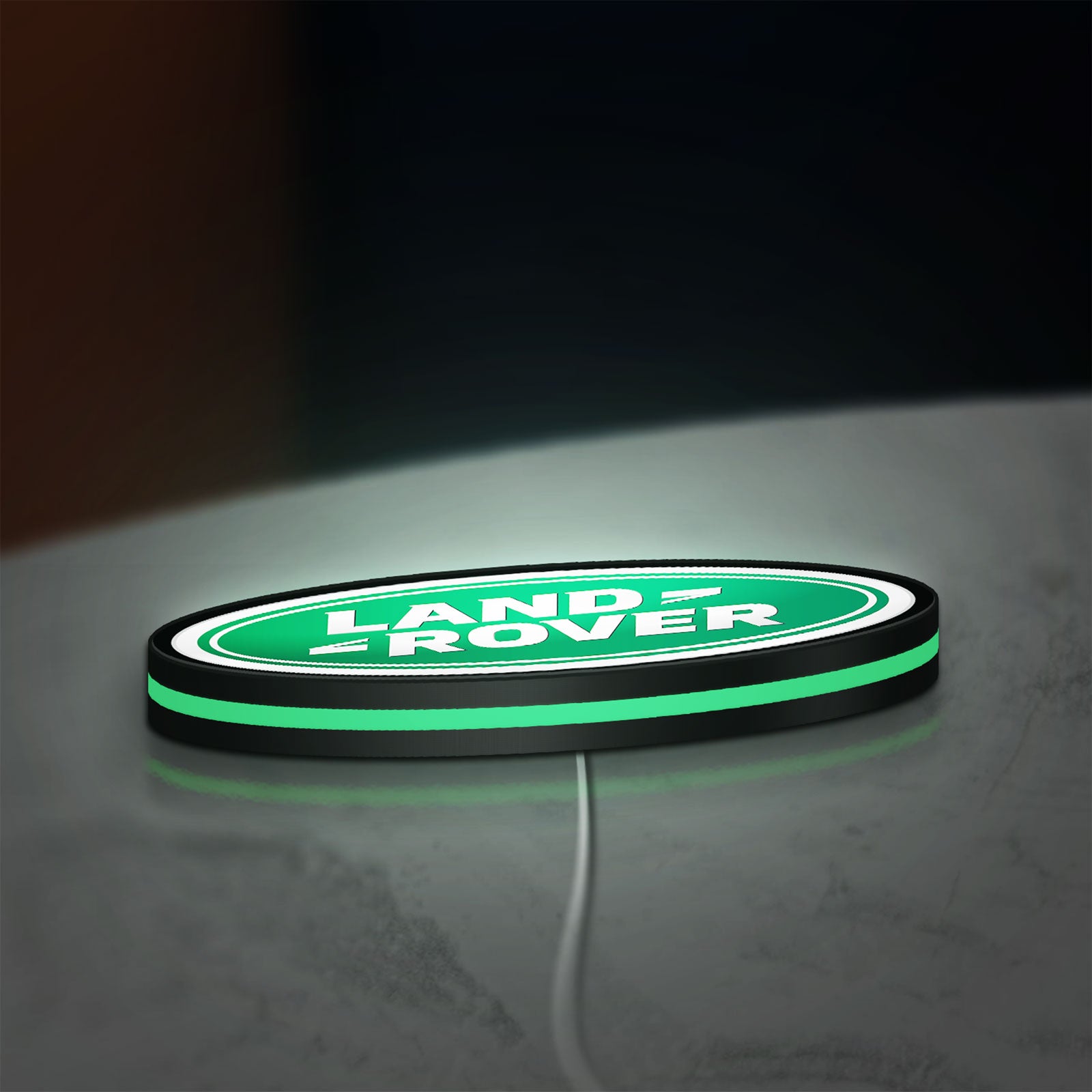 Land Rover LED lightbox lying flat on a desk with green glow