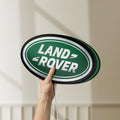 Unlit Land Rover LED lightbox held by hand to show size and details
