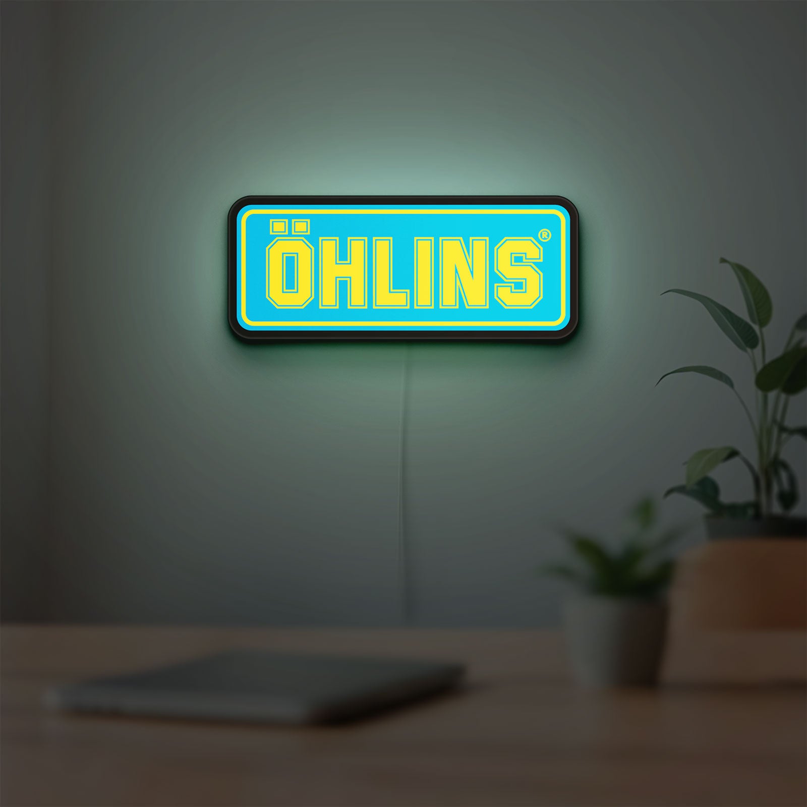 Ohlins LED lightbox hanging on a room wall with soft blue light